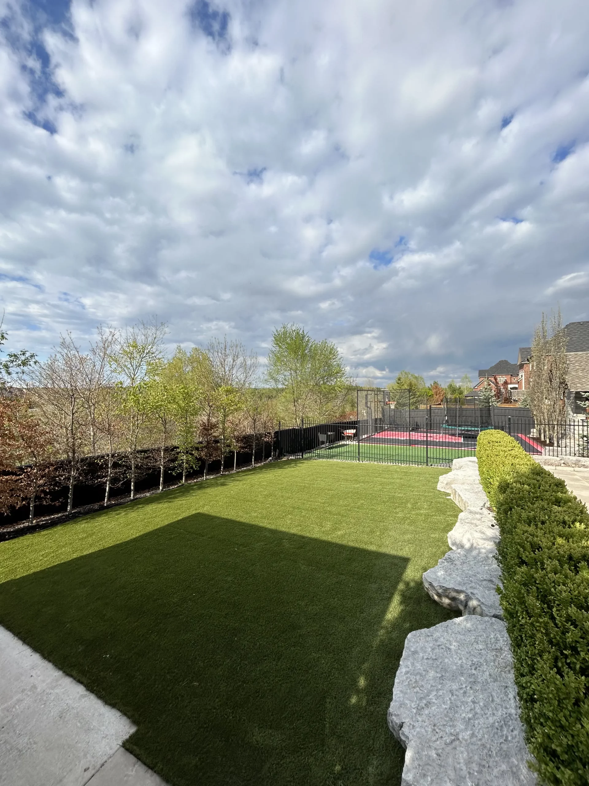 Backyard artificial grass installation in Markham